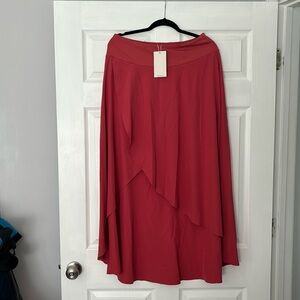 Halara. Never worn. Coral. Size L with built in shorts